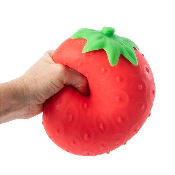 RMS SmushMart giant strawberry squishy being squeezed by hand